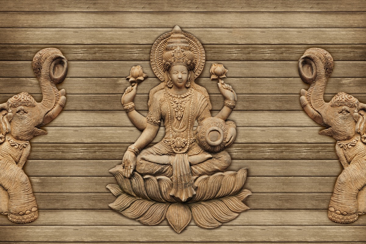 wooden figure of the hindu goddess lakshmi 