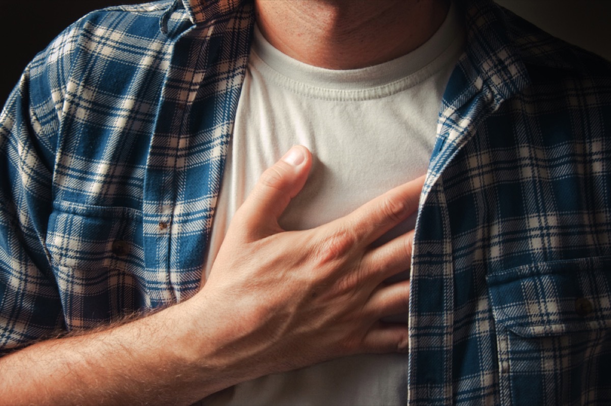 close up of man's hand on chest