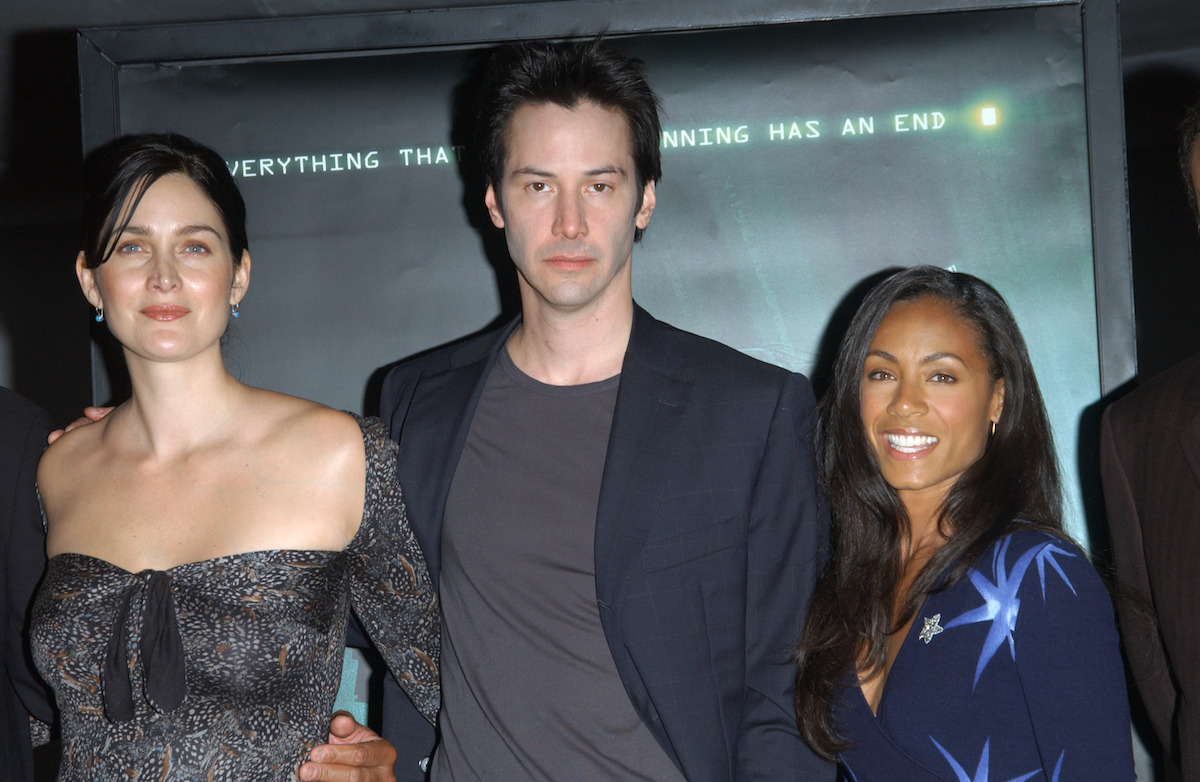Carrie-Anne Moss, Keanu Reeves, and Jada Pinkett Smith at a press conference for
