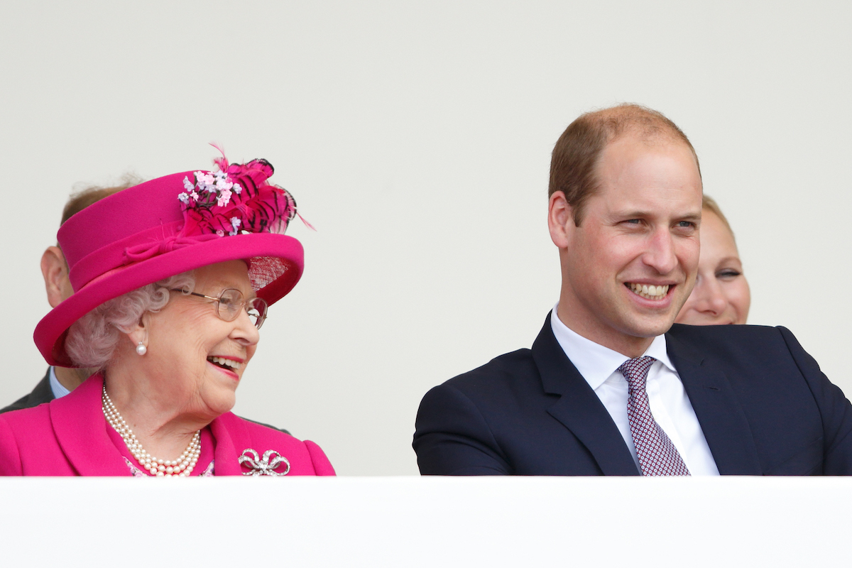 Queen Elizabeth II and Prince William, Duke of Cambridge watch a carnival parade as they attend 'The Patron's Lunch' celebrations to mark Queen Elizabeth II's 90th birthday on The Mall on June 12, 2016 in London, England.