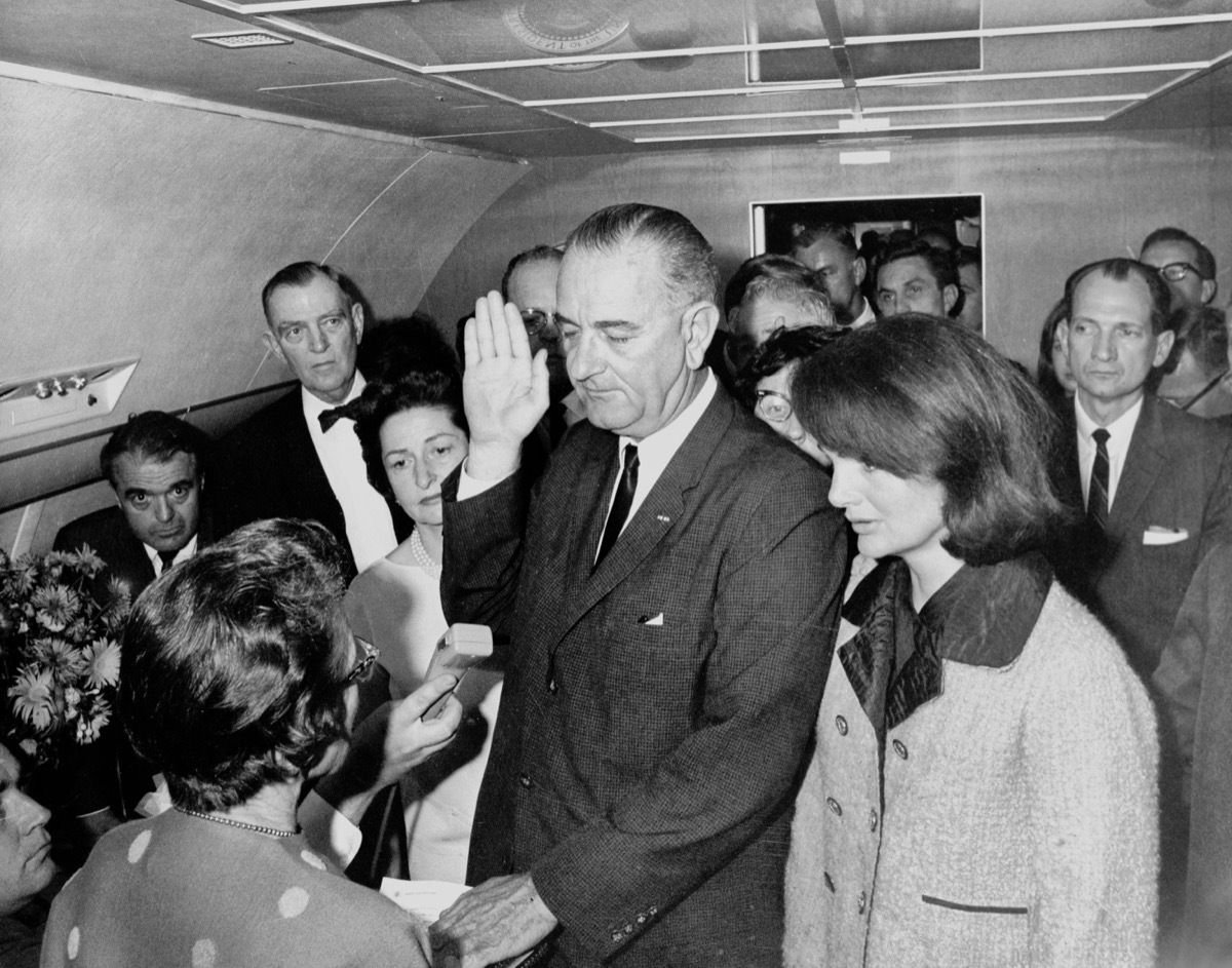 Lyndon B. Johnson getting sworn in next to Jackie Kennedy Jackie Kennedy Pink Chanel Suit