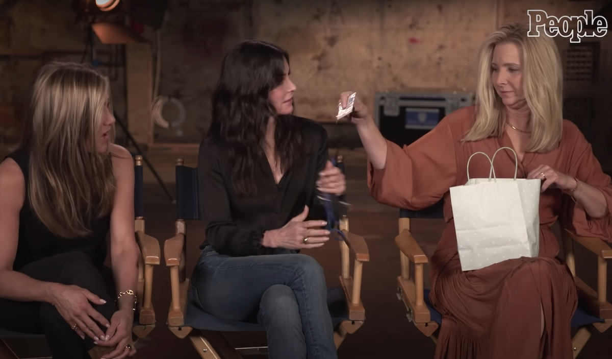 Jennifer Aniston, Courtney Cox, and Lisa Kudrow being interviewed by