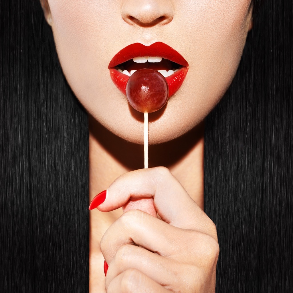 Woman licking lollipop awesome facts