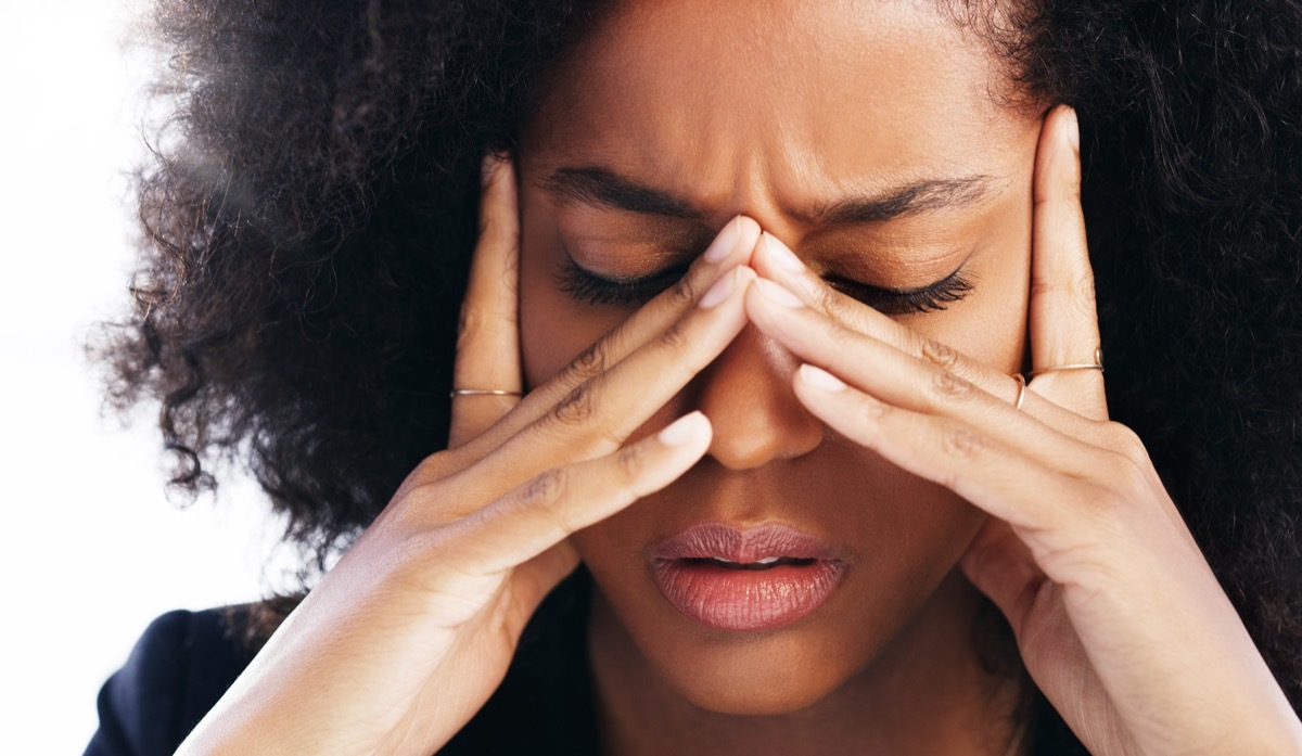 Woman rubbing eyes because of vision problems