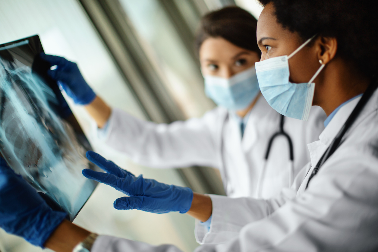 Doctors analyzing an x-ray image.