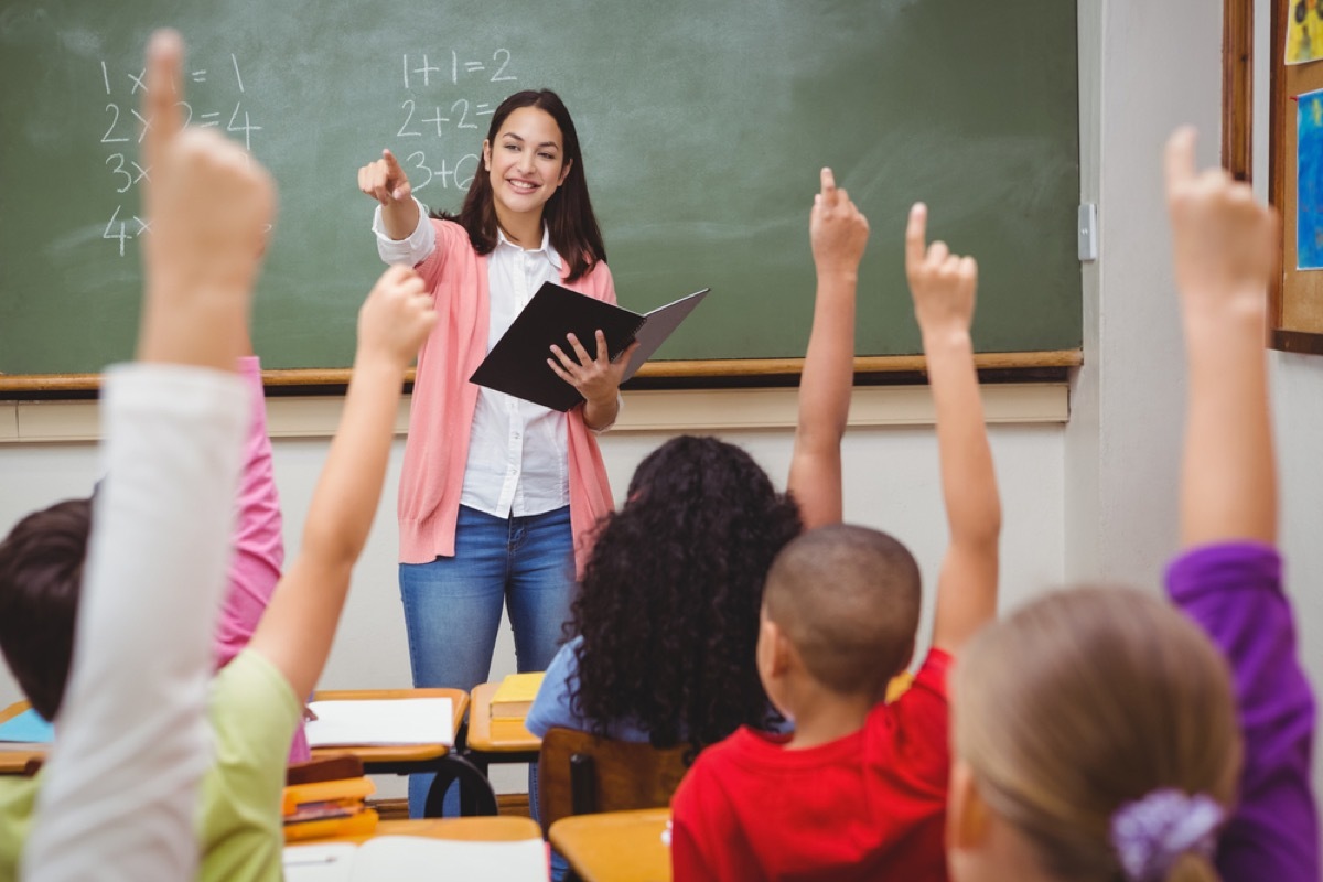 teacher in classroom with students old-fashioned manners