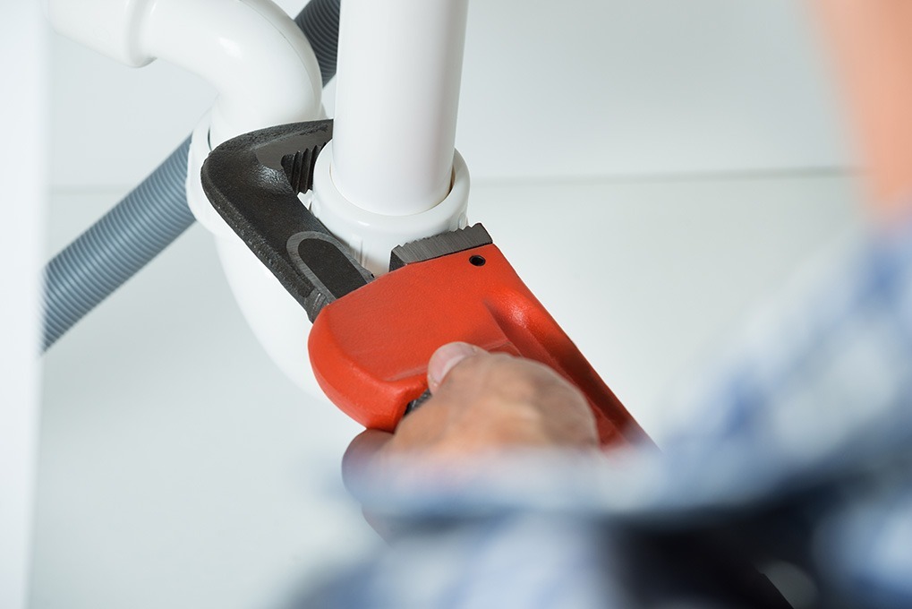 plumber fixing pipe home problems