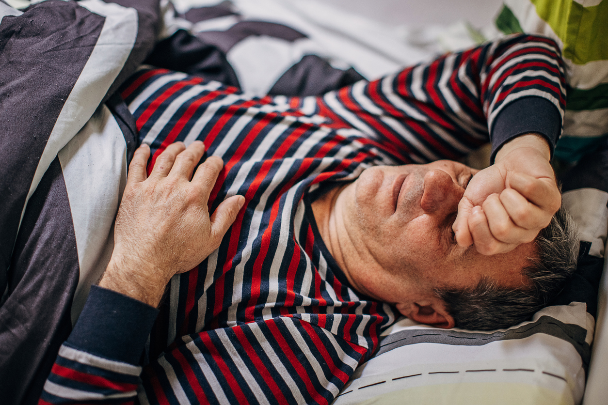 Man sleeping restlessly