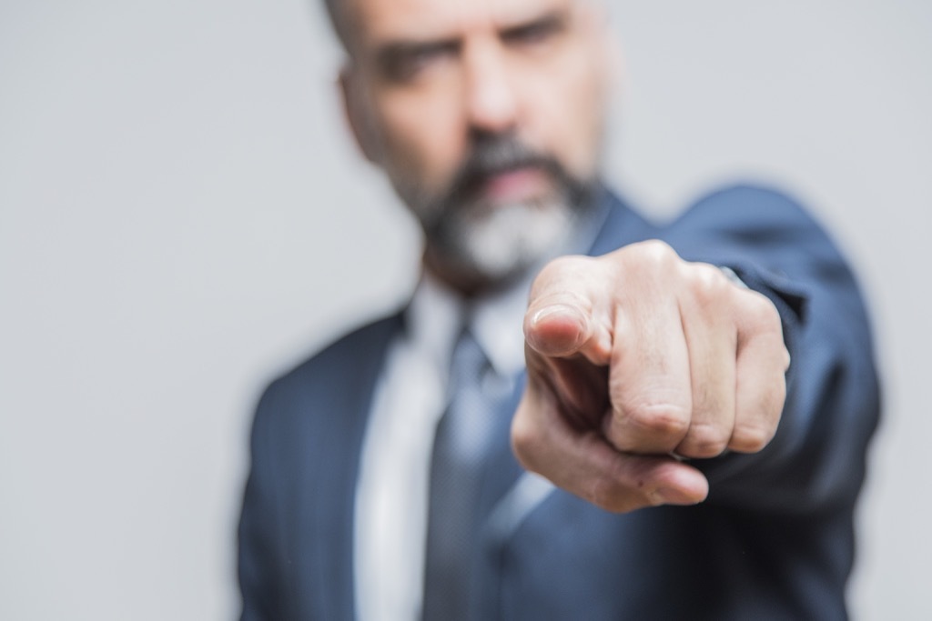 Man pointing the finger at others, etiquette mistakes