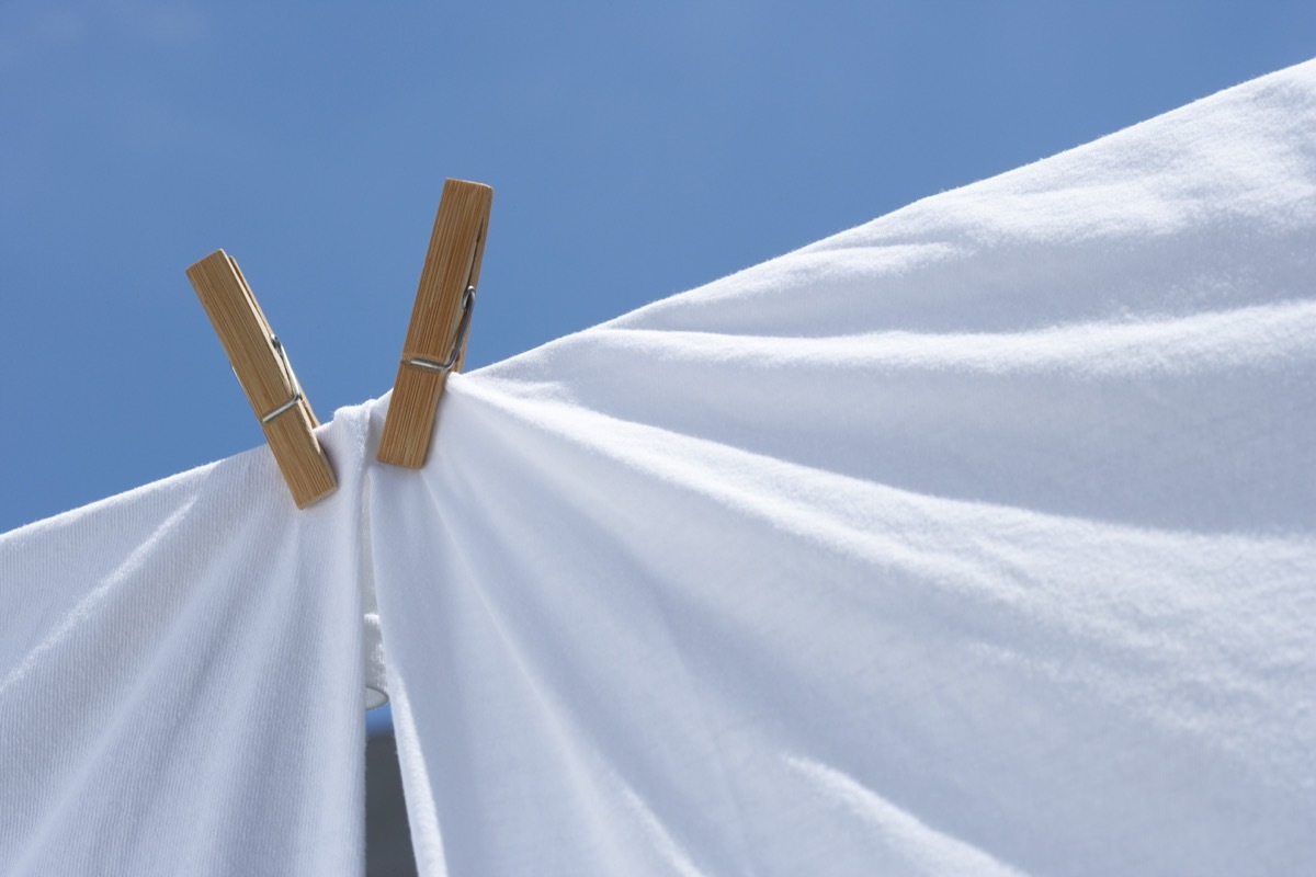 clothes line with two white sheets