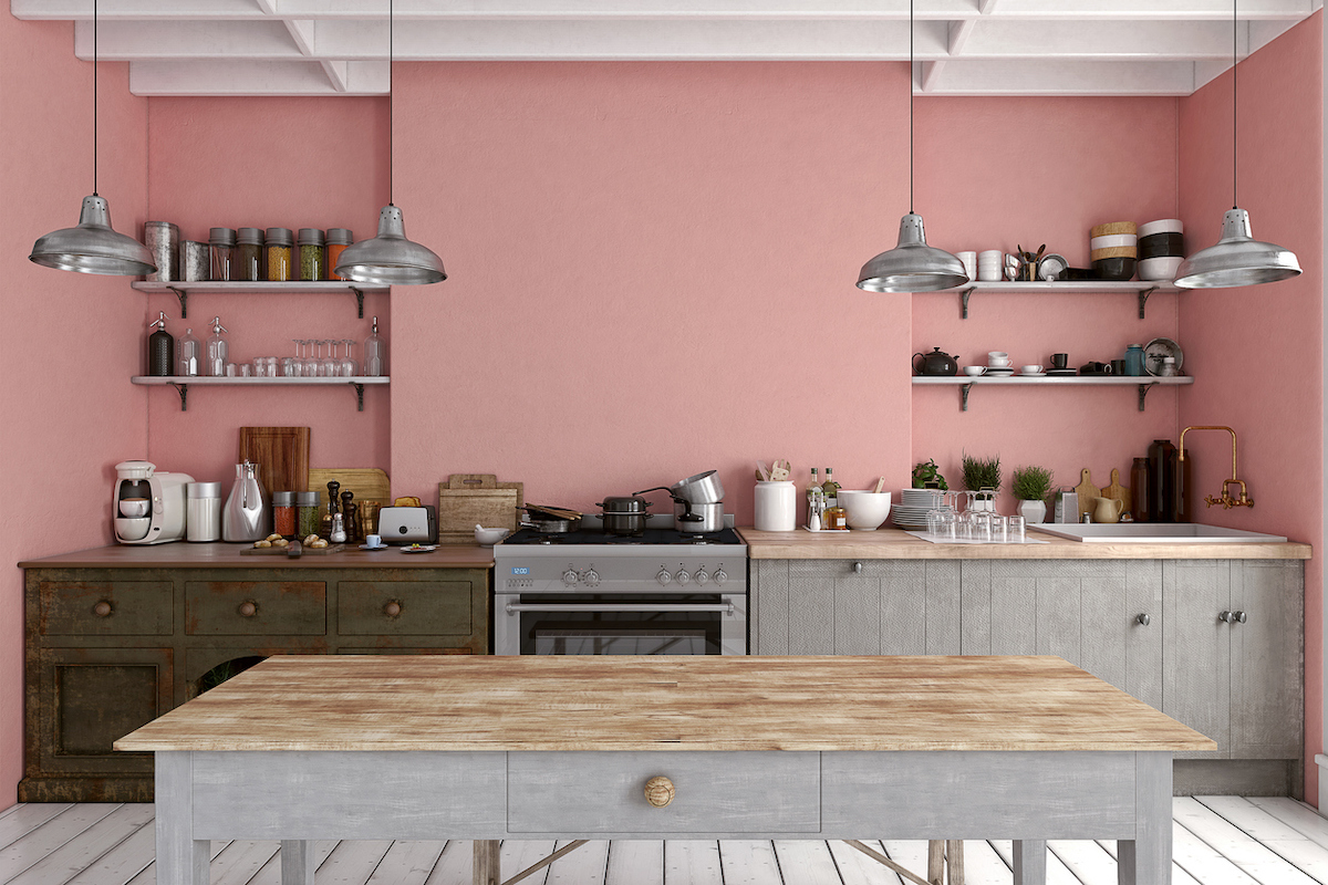 Kitchen with pink walls and gray cabinets