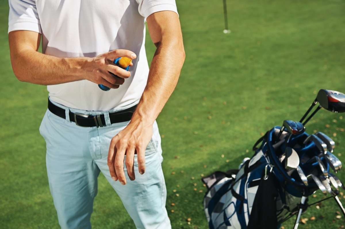 Man Putting on Sunscreen at the Golf Course Healthy Man