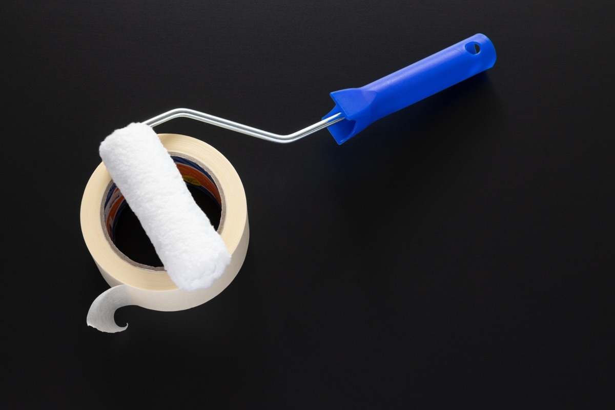 a typical painting roller isolated on black background