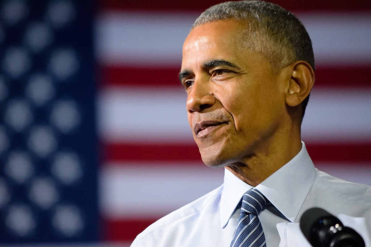 Former President Barack Obama with the US flag in the background as he delivers a speech at a campaign rally for the presumptive democratic nominee in Charlotte.