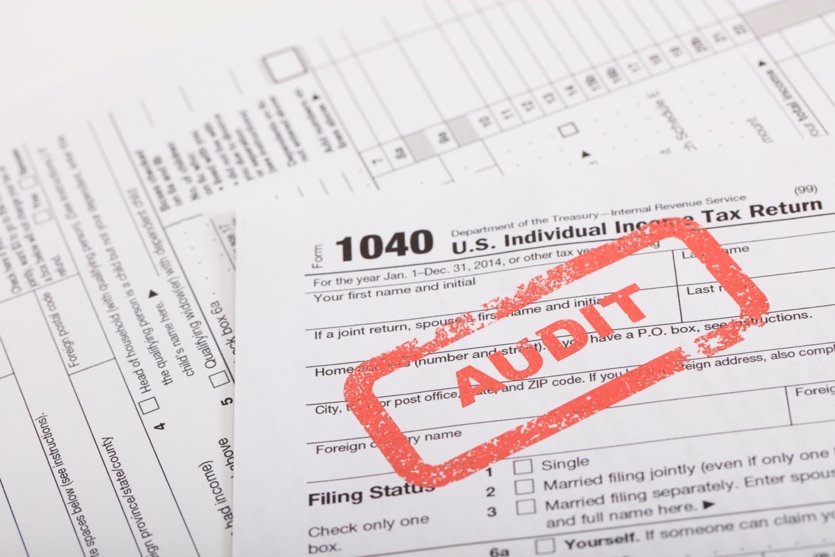 A stock photo of a Red Audit stamp on a 1040 US individual income tax return. Photographed at 50mp with the Canon EOS 5DSR and the 100mm 2.8 L lens.