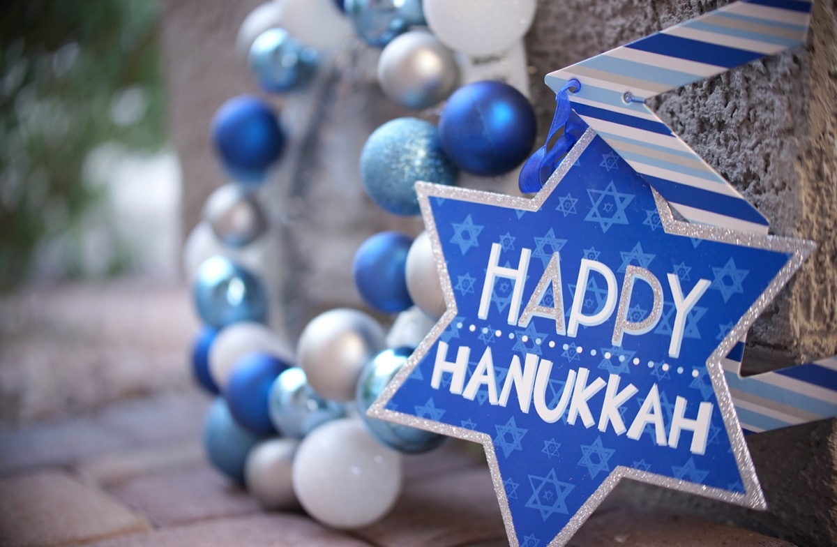 blue star of david hanukkah decoration and wreath