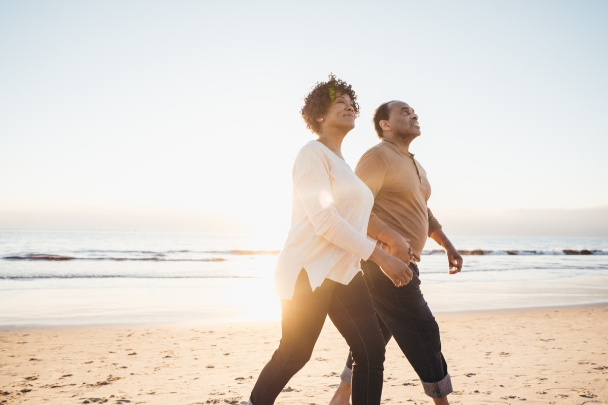 Senior couple walking by the seashore