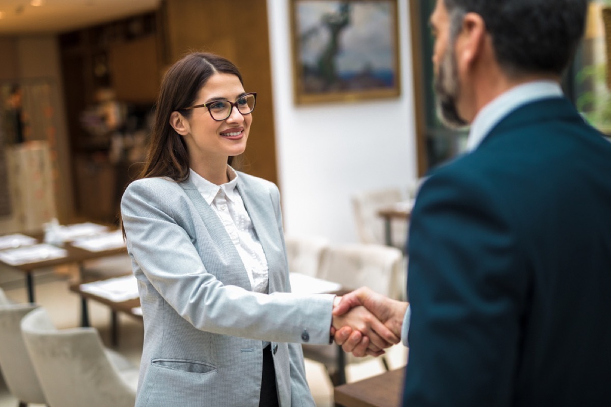 colleagues shaking hands, handshake, office etiquette