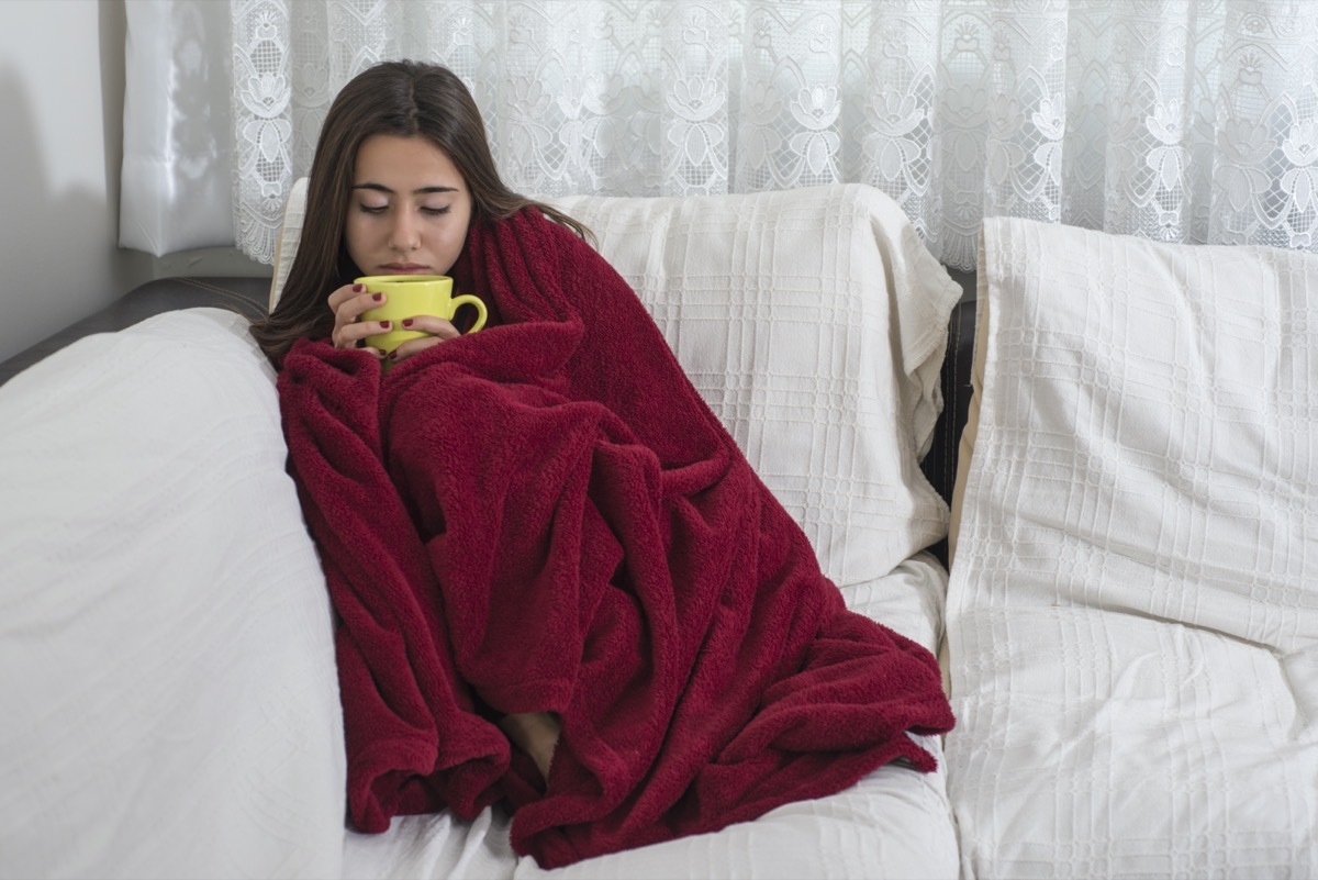 with fever drinking cup of warm tea