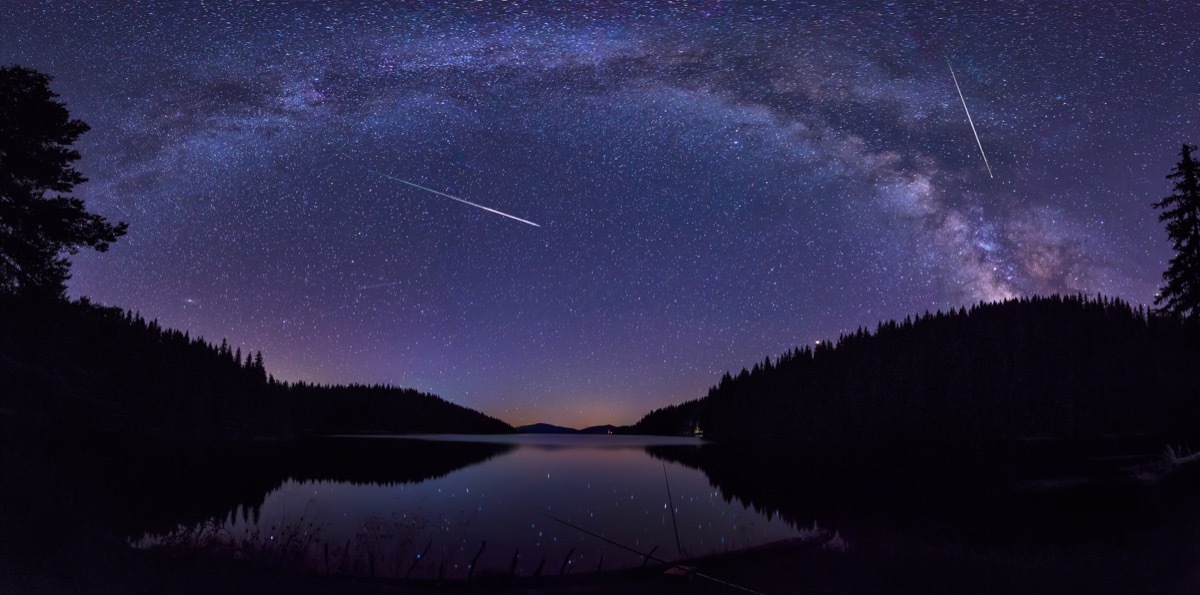 Meteor shower over body of water